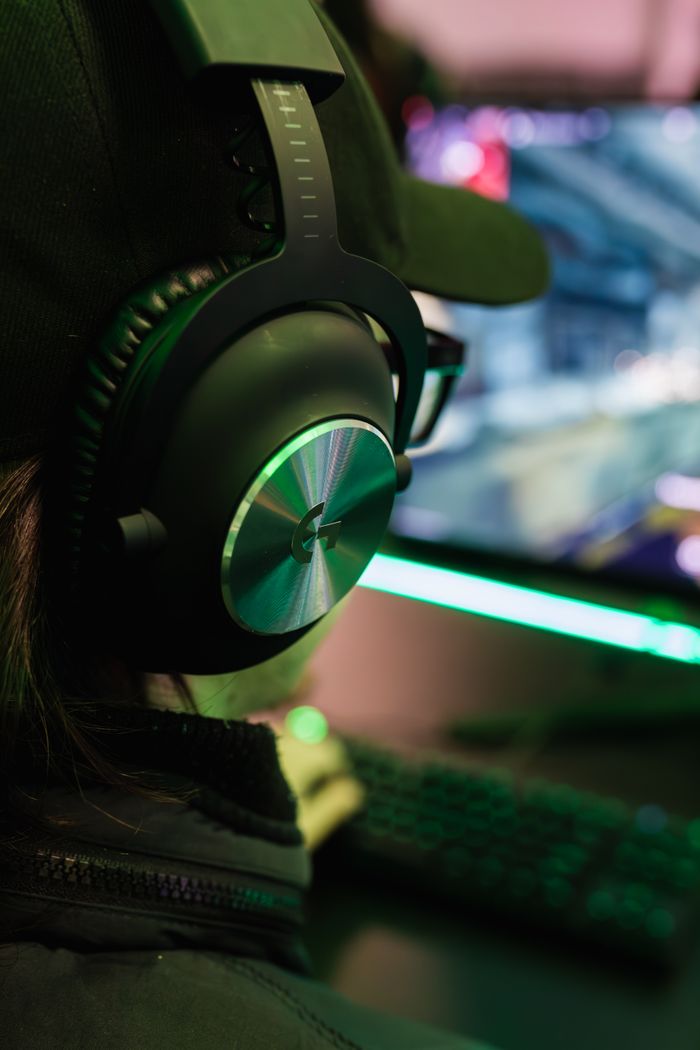 The Art of Drawing Readers In: Your attractive post title goes here A gamer wearing headphones plays video games on a computer at night, immersed in the virtual world.